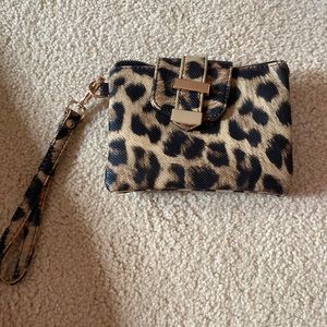 Charming Charlie wristlet/clutch/shoulder bag in leopard print.